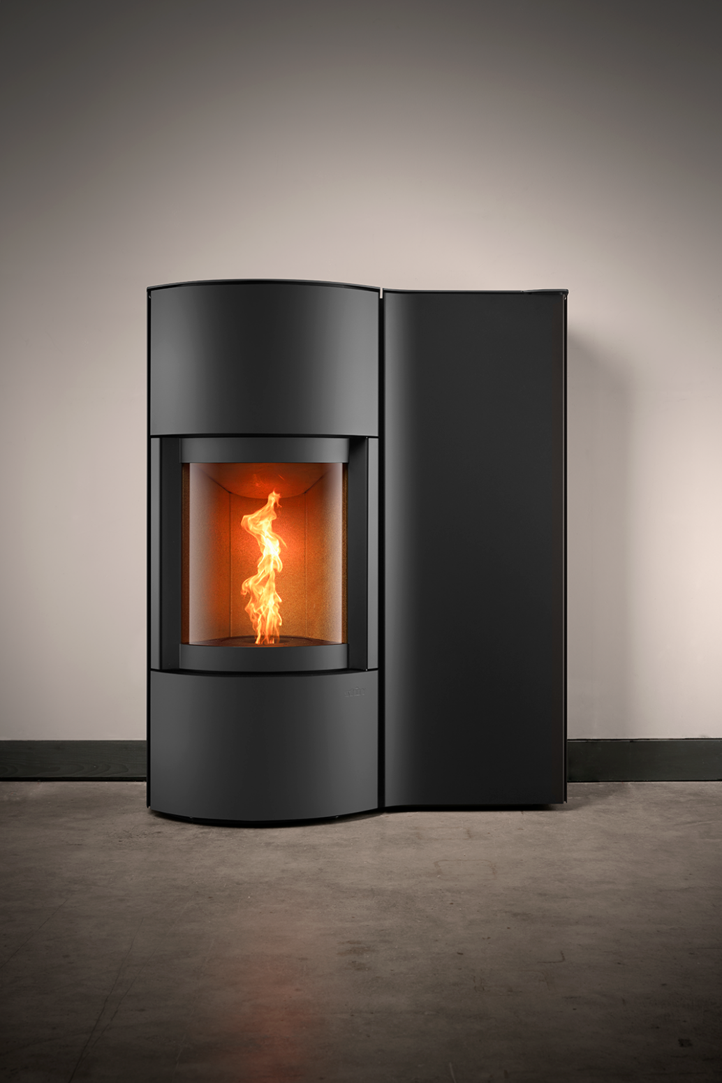 Black Cylindrical SP-20B Modern Indoor Pellet Stove with Glass Fire screen and a visible pellet burning flame. High-efficiency, autonomous, Ultra quiet smart control Home heating luxury pellet fireplace. Eco-Friendly Fireplace, Freestanding pellet stove. This pellet stove is similar to Aduro by Osburn H1 Hybrid Wood/Pellet Stove SF00401, ComfortBilt 2200-sq ft Pellet stove with 47-lb Hopper, Dielle Grecale 70 Pellet Stove - Pearl White Steel With Magic Black Glass Front, Freedom Stoves Pellet Stove.