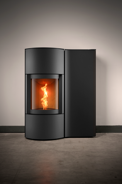 Black Cylindrical SP-20B Modern Indoor Pellet Stove with Glass Fire screen and a visible pellet burning flame. High-efficiency, autonomous, Ultra quiet smart control Home heating luxury pellet fireplace. Eco-Friendly Fireplace, Freestanding pellet stove. This pellet stove is similar to Aduro by Osburn H1 Hybrid Wood/Pellet Stove SF00401, ComfortBilt 2200-sq ft Pellet stove with 47-lb Hopper, Dielle Grecale 70 Pellet Stove - Pearl White Steel With Magic Black Glass Front, Freedom Stoves Pellet Stove.