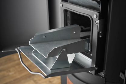 open hopper for loading pellet to Matte Black Stûv P-20S Freestanding Modern Indoor pellet burning stove in large close spade with visible burning flame and pellet twin set container beside the fireplace. Elegance, silence, performance, ease of use and maintenance Fireplace. This pellet stove is similar to Stûv 30 Wood Stove | Compact Glass Fire Screen Stove | 360° Adjustable Rotating Wood Burning Stove With Double Walls, Osburn Aduro H1 Pellet/Wood Combo Hybrid Free Standing Stove SF00401, Comfortbilt.