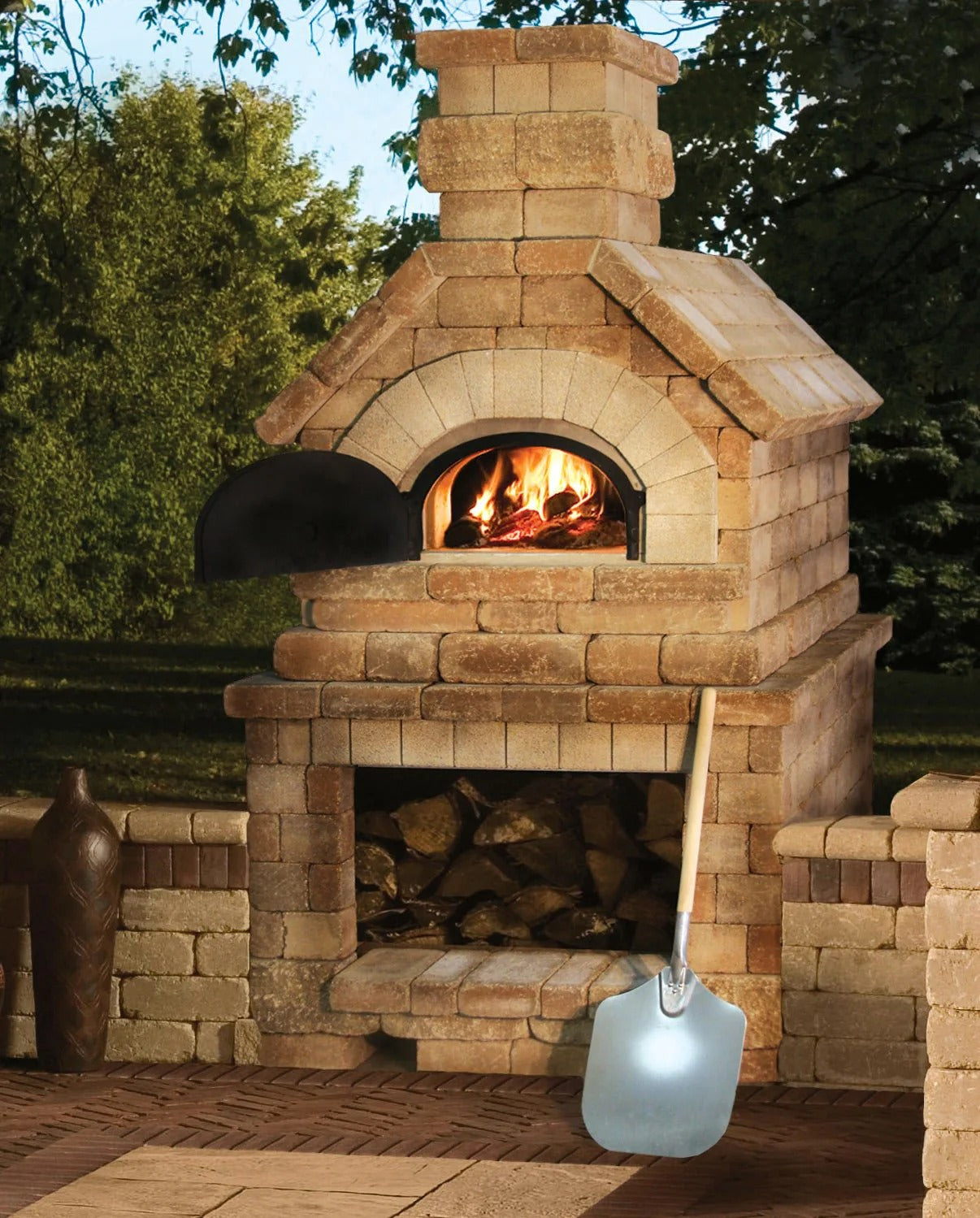 Brick outdoor Wood Wood fired pizza oven with wood storage on a patio outdoor kitchen setup ready to make your perfect outdoor kitchen. CBO 750 Hybrid Pizza Oven, dual fuel pizza oven, outdoor wood fired pizza oven, natural gas pizza oven, DIY pizza oven kit, residential countertop pizza oven, Chicago Brick Oven, backyard pizza oven, outdoor kitchen pizza oven, hybrid pizza oven for home. Alfa Pizza Oven 3 pizze but better made in America  with built in Gas BBQ LPG NG Pizza Oven Wood Burning Ooni Gozney