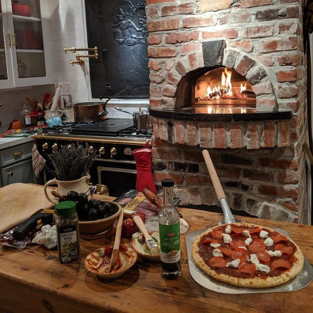 Brick Indoor Wood Wood fired pizza oven with wood burning flame inside the oven. CBO 750 Hybrid Pizza Oven, dual fuel pizza oven, outdoor wood fired pizza oven, natural gas pizza oven, DIY pizza oven kit, residential countertop pizza oven, Chicago Brick Oven, backyard pizza oven, outdoor kitchen pizza oven, hybrid pizza oven for home. Alfa Pizza Oven 3 pizze but better made in America  with built in Gas BBQ LPG NG Pizza Oven Wood Burning Ooni Gozneyde.