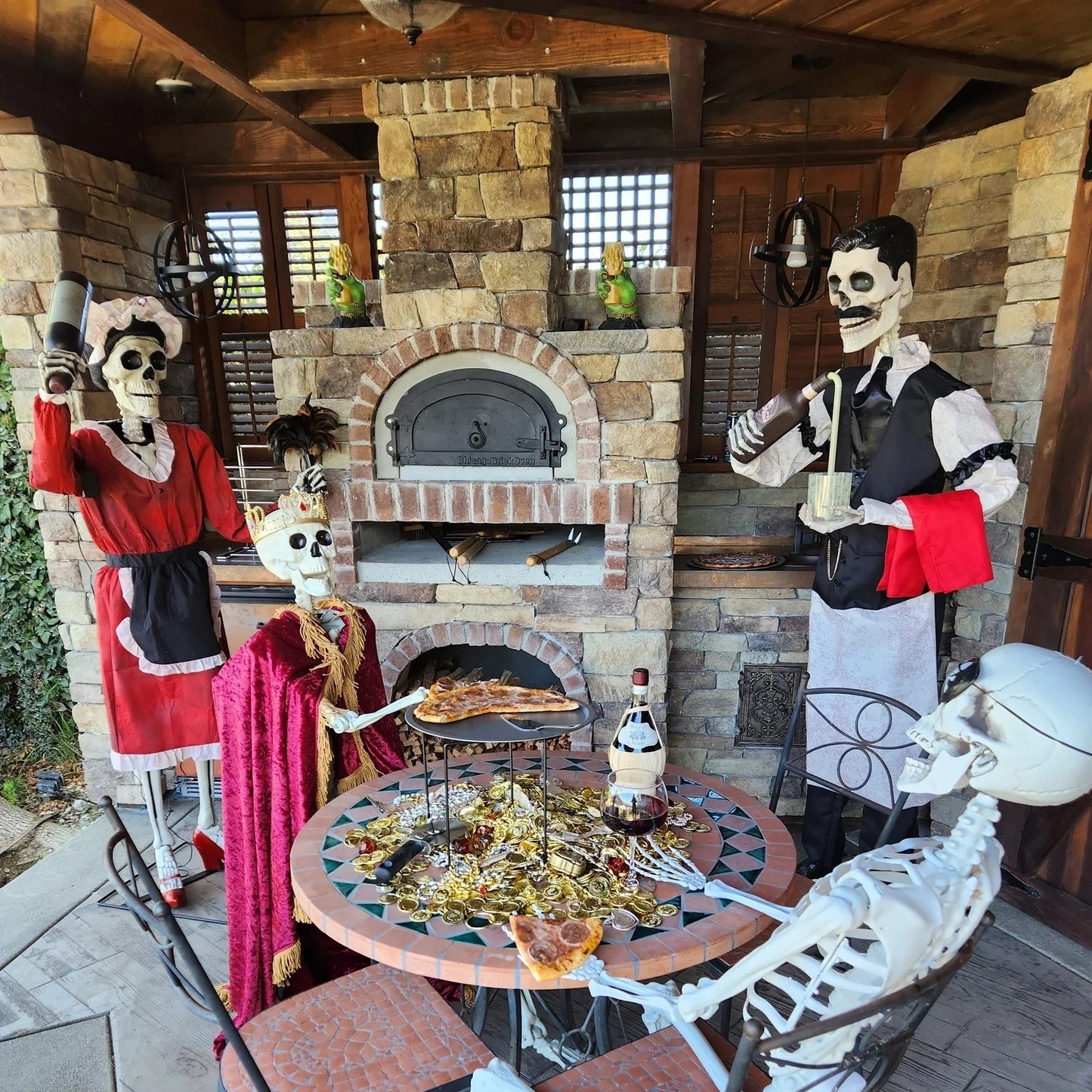 Brick outdoor Wood fired pizza oven with wood storage on a patio outdoor kitchen setup ready to make your perfect outdoor kitchen. CBO 750 Hybrid Pizza Oven, dual fuel pizza oven, outdoor wood fired pizza oven, natural gas pizza oven, DIY pizza oven kit, residential countertop pizza oven, Chicago Brick Oven, backyard pizza oven, outdoor kitchen pizza oven, hybrid pizza oven for home. Alfa Pizza Oven 3 pizze but better made in America  with built in Gas BBQ LPG NG Pizza Oven Wood Burning Ooni Gozney
