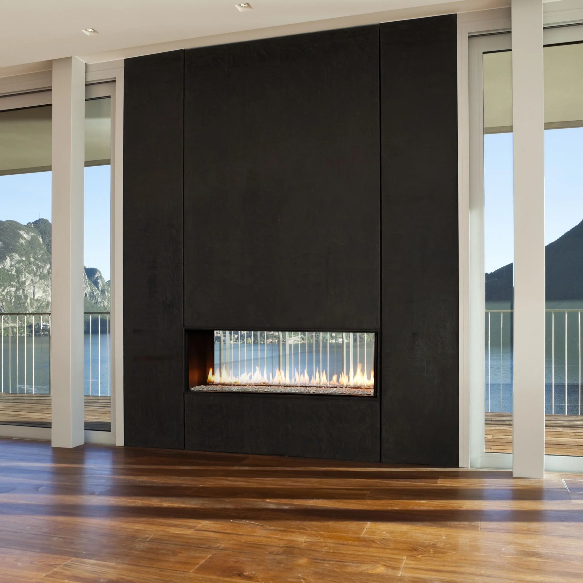Elegant Montigo Exemplar Built-In See Through Linear Gas Fireplaces Inserts into a black Surrounds in a modern living room with wooden flooring and large windows. Eco-Friendly Modern indoor Gas Fireplace suitable for home and commercial spaces.
Create a modern look with one of our many exquisitegas fireplaces. This Eco-friendly Montigo Exemplar is similar to 48" Isokern Maximus Linear Gas Fireplace, Napoleon Clearion Elite See-Through Fireplace, Empire 48" Boulevard Direct Vent See-Through fireplace.