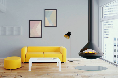 36" Modern Suspended/Floating See through Black Vita Aidan Fireplace in a Ash painted room with yellow sofa, wall art and Fireplace in the middle. Dynamic Water Vapor-Fire tech and Wood burning UFO design Fireplace. This Mid-century design hanging fireplace offers efficient heating, easy installation, and elegance. Aidan suspended fireplace is similar to Focus Ergofocus Holographic Suspended  Electric Fireplace, Focus GYROFOCUS Fireplace, Shine 1 Luxury Hanging Disc-Shaped Real Wood Burning Fire Fireplace.
