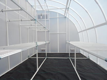 Inside view of a 8'x12' solexx harvester wall mounted small greenhouse 