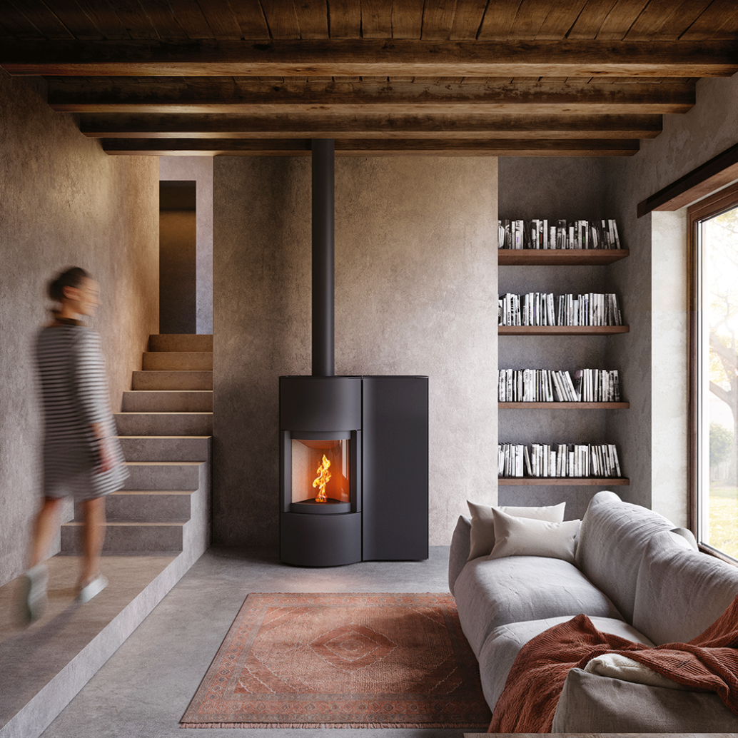 Black Cylindrical SP-20B Modern Indoor Pellet Stove with Glass Fire screen and a visible pellet burning flame. High-efficiency, autonomous, Ultra quiet smart control Home heating luxury pellet fireplace. Eco-Friendly Fireplace, Freestanding pellet stove. This pellet stove is similar to Aduro by Osburn H1 Hybrid Wood/Pellet Stove SF00401, ComfortBilt 2200-sq ft Pellet stove with 47-lb Hopper, Dielle Grecale 70 Pellet Stove - Pearl White Steel With Magic Black Glass Front, Freedom Stoves Pellet Stove.