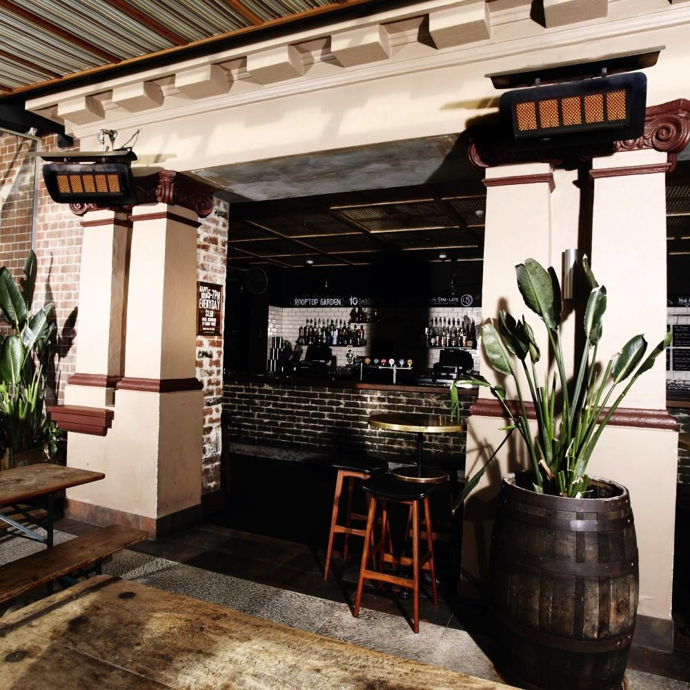 Outdoor Living with two wall hanged Bromic Tungsten 500 series Smart-heat Propane heater LP- 43,000