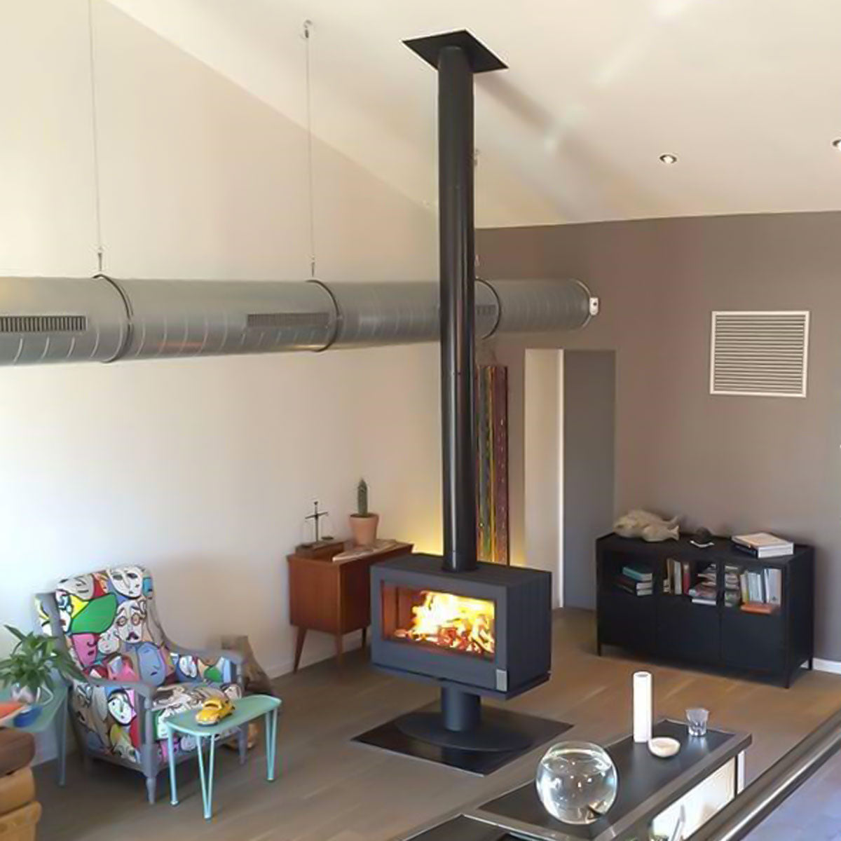 Modern Office Space Heating Wood Stove Stove Bench This black sandblasted steel bench is both modern and practical. It has 4 levelers.  Available in two sizes (39 Inches, 63 Inches) , it allows you to install your Preston, Aaron or Réva stove