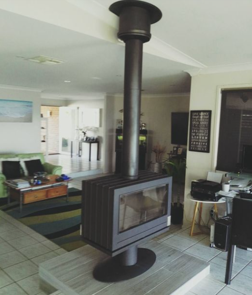 Center of Living room See through cast iron wood burning stove