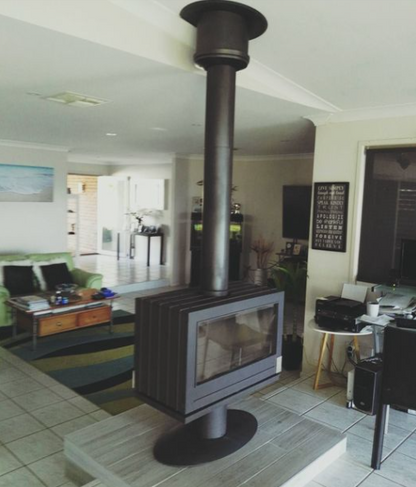 Center of Living room See through cast iron wood burning stove