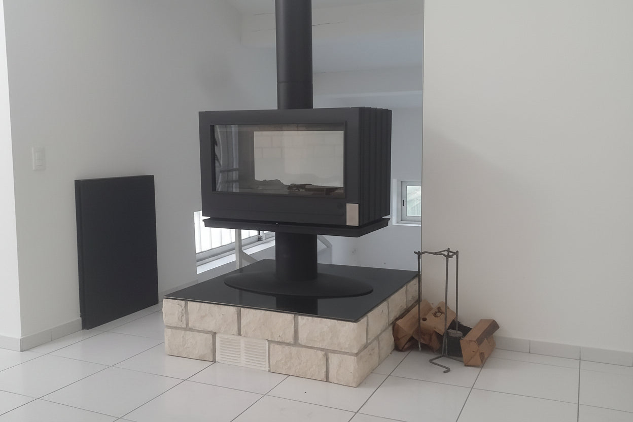elevated Glass Fireplace with a modern French design. This see through design allows the room to stay open double glass see through fireplace JOTUL STU Don Bar Napoleon custom designed custom built big glass