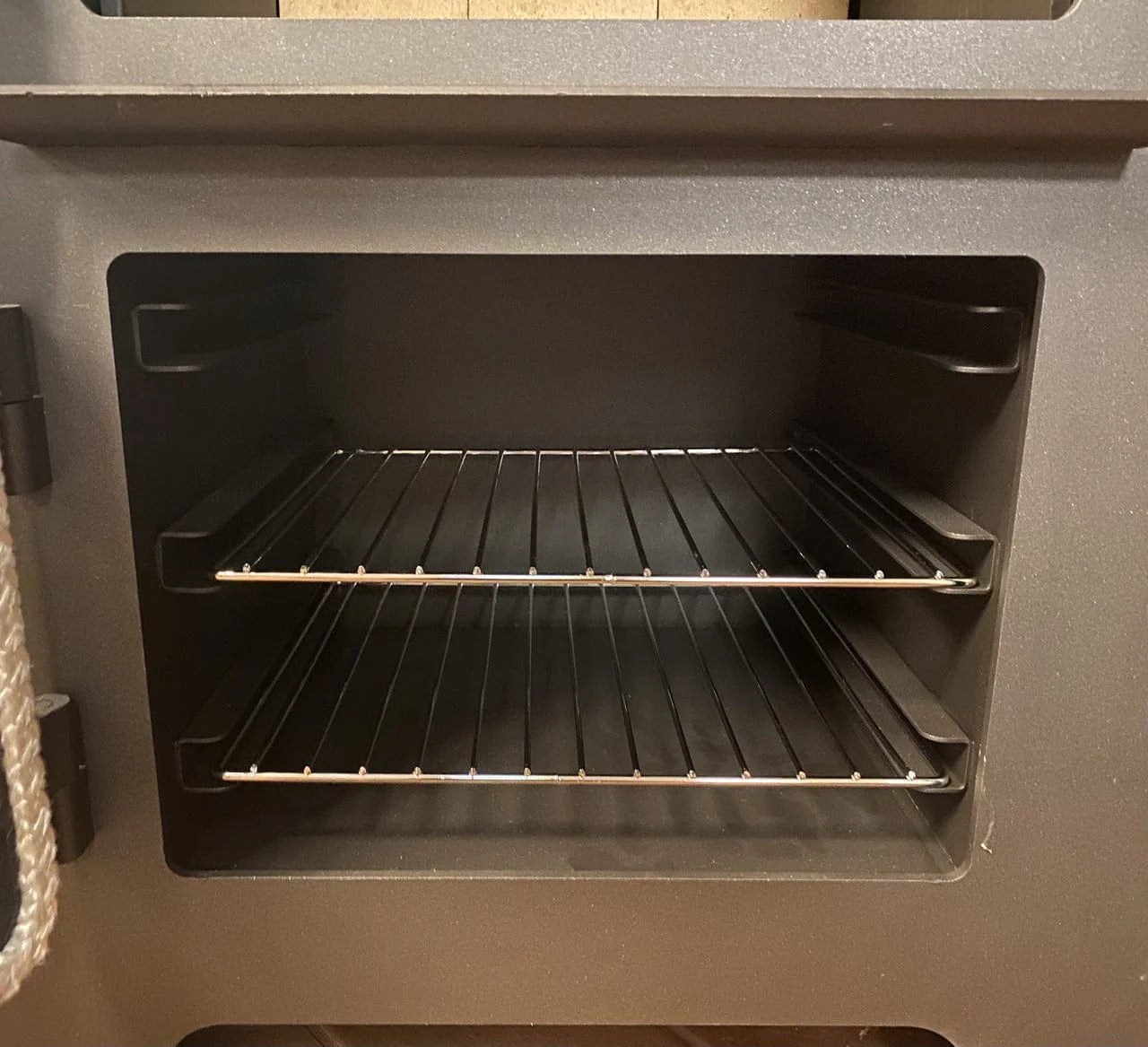 Oven area for the dual purpose cast iron stove and oven with a wood cooktop for you home or cabin. indoor wood heat. 